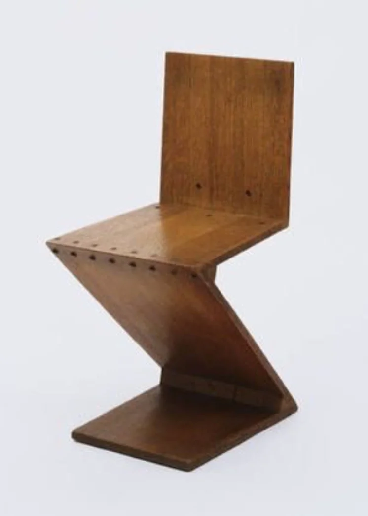 Gerrit Rietveld's Zigzag Chair: oak planes joined into a single Z.