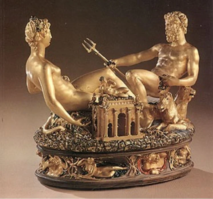 Benvenuto Cellini's Saliera: a gold salt cellar with reclining figures of the sea and the earth facing each other across a small temple.